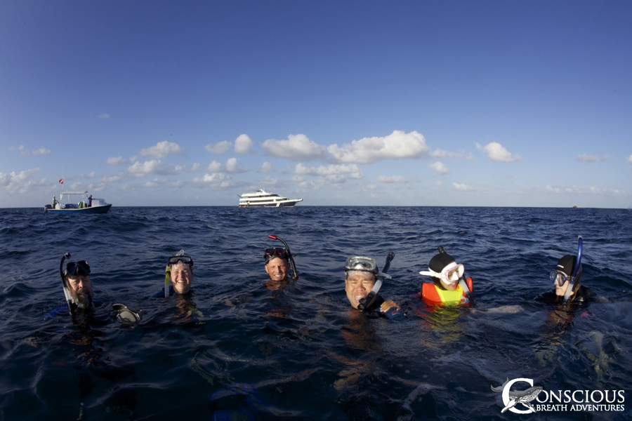 Happy guests after swimming with whales close to the anchorage